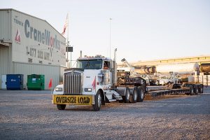 A Truck That Is Driving Down The Road
