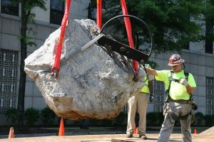 A Person Standing In Front Of A Building
